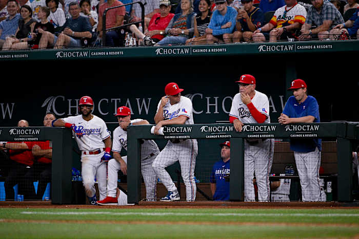 Jul 3, 2023; Arlington, Texas, USA; The Texas Rangers team watches the game against the Houston Astros during the ninth inning at Globe Life Field. Mandatory Credit: Jerome Miron-USA TODAY Sports